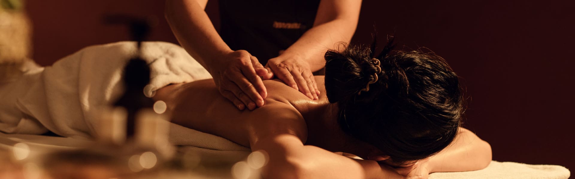 Sand-Creek-Crossing-Page-Banner-Better-Massage Woman receiving a massage on a massage table